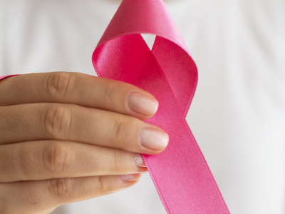 close-up-woman-holding-up-awareness-ribbon